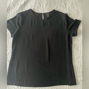Worthington, black short sleeve blouse with closure in the back hits at the hip